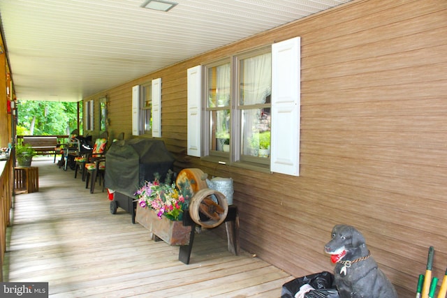 deck with a porch and grilling area