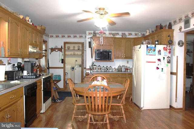 kitchen featuring ceiling fan, black appliances, dark hardwood / wood-style floors, and washer / dryer