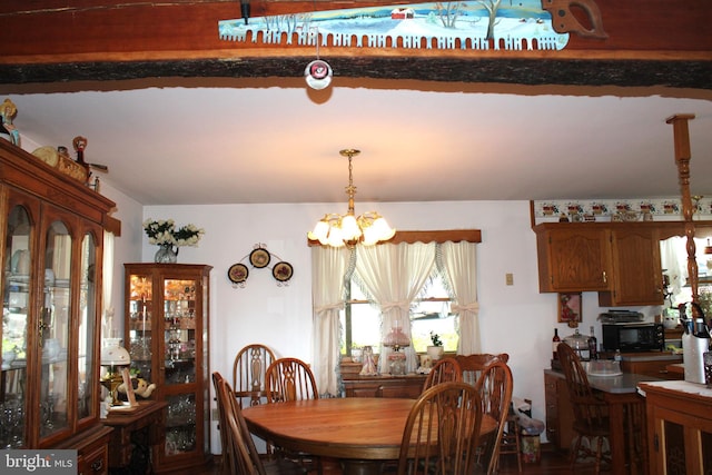 dining space with an inviting chandelier