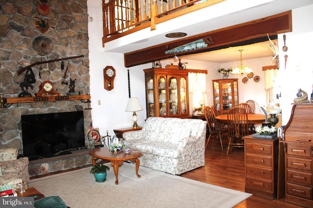 living room with hardwood / wood-style floors and a notable chandelier