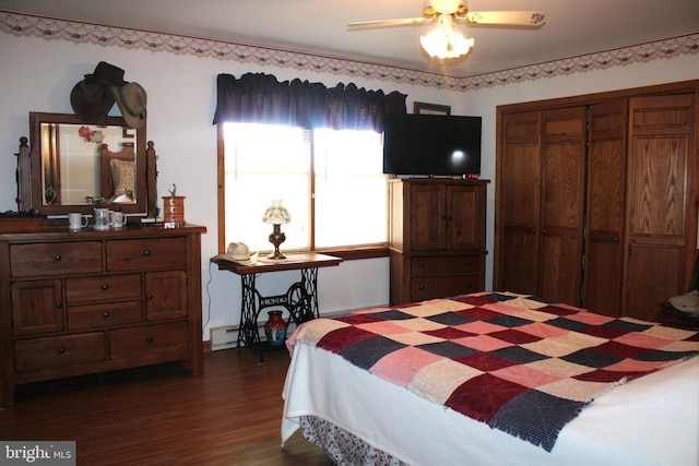 bedroom with dark hardwood / wood-style floors, ceiling fan, and a closet