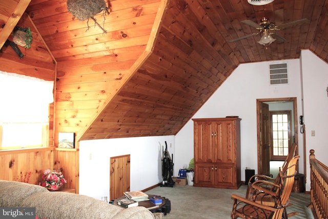 living room with carpet, ceiling fan, wooden ceiling, and a wealth of natural light