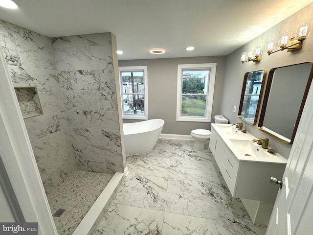 full bathroom with vanity, shower with separate bathtub, and toilet