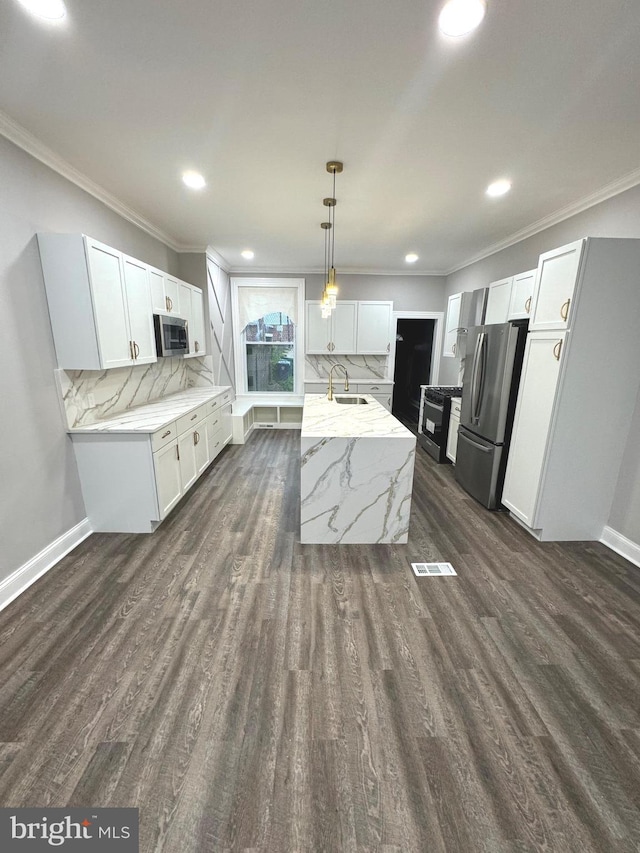 kitchen with white cabinetry, sink, pendant lighting, and stainless steel appliances