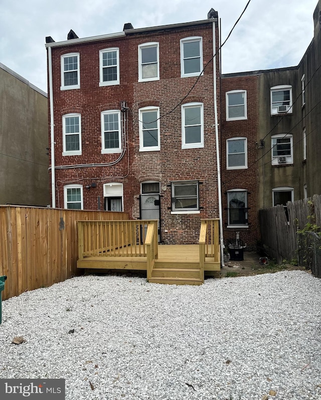 view of front of property with a wooden deck