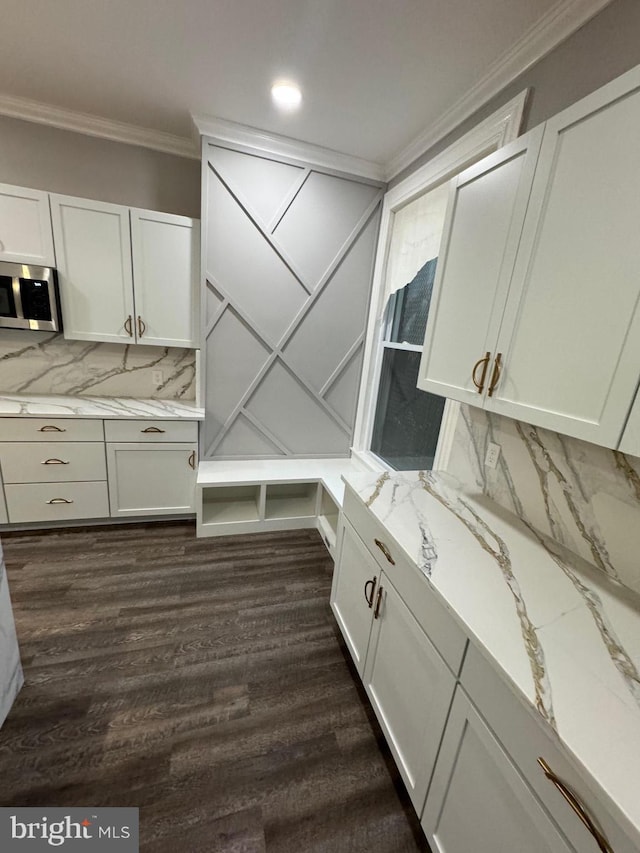 interior space featuring crown molding, wood-type flooring, and tasteful backsplash