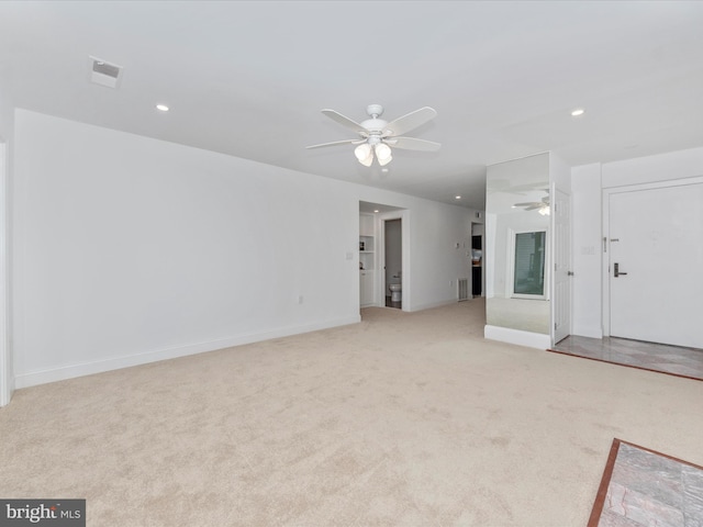 unfurnished living room with light carpet