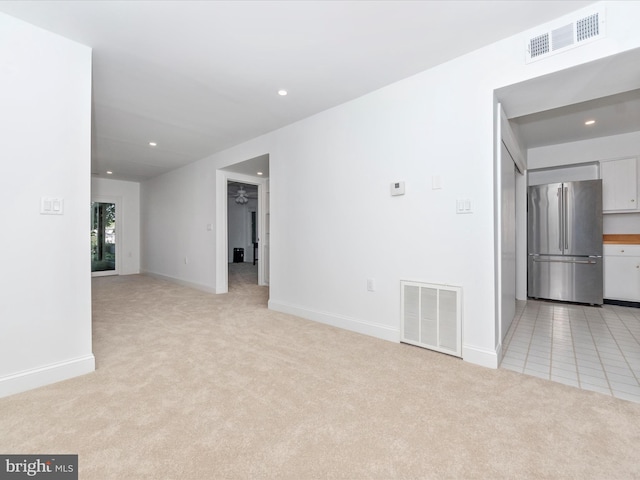 empty room featuring light colored carpet