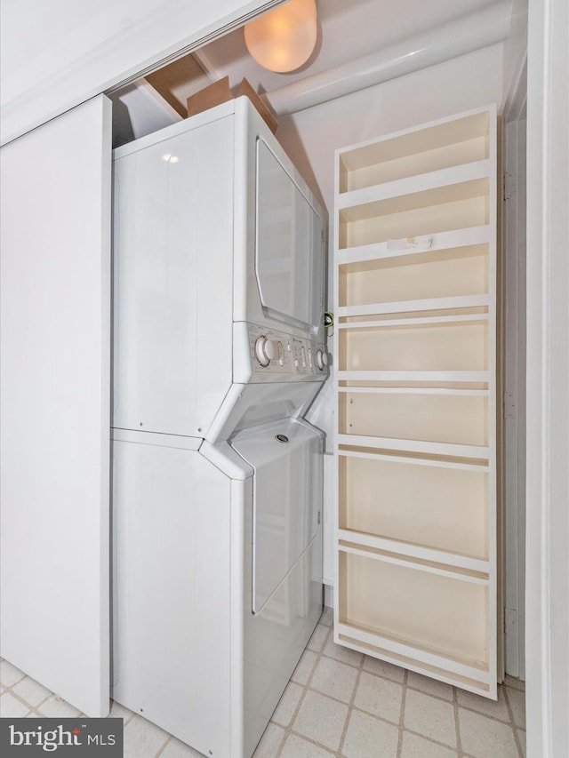 laundry area with stacked washer and dryer