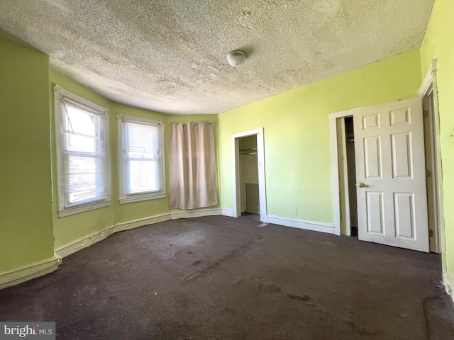 unfurnished bedroom with a textured ceiling