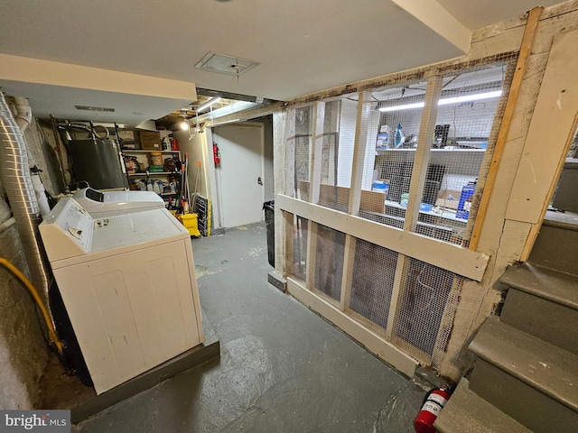 basement featuring washer and clothes dryer and gas water heater