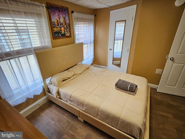 bedroom featuring dark hardwood / wood-style floors