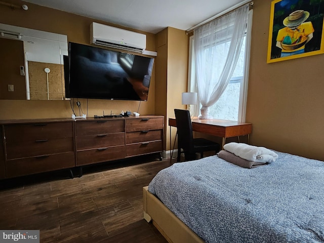 bedroom with dark hardwood / wood-style flooring and a wall mounted air conditioner