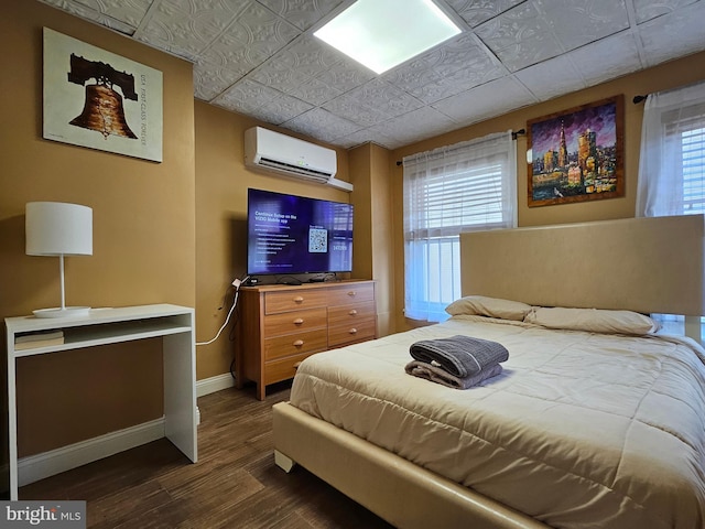 bedroom with dark wood-type flooring, multiple windows, and a wall mounted air conditioner