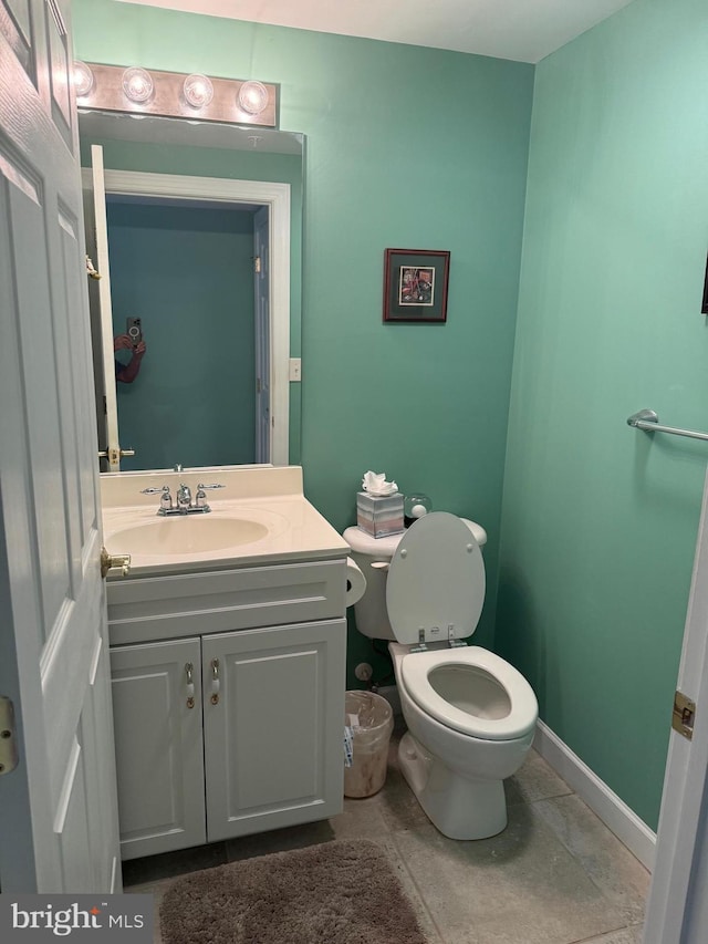 bathroom with toilet and vanity