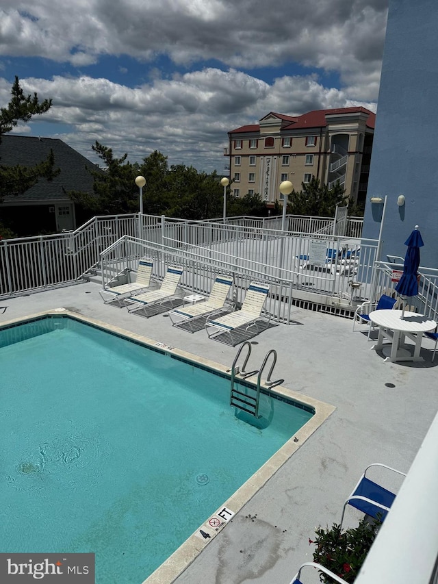 view of pool with a patio area