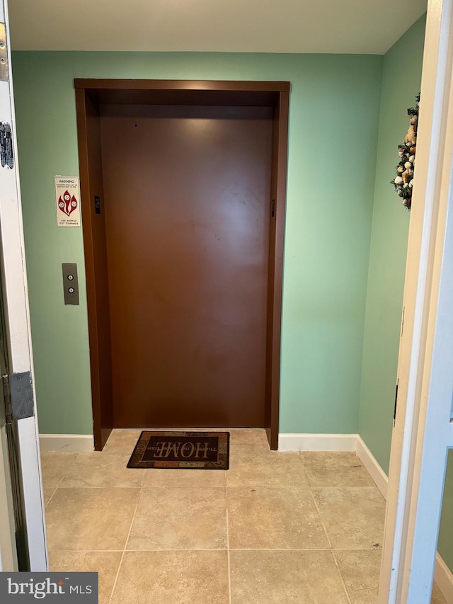 doorway to outside with elevator