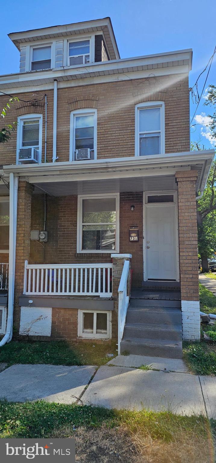 view of property with covered porch