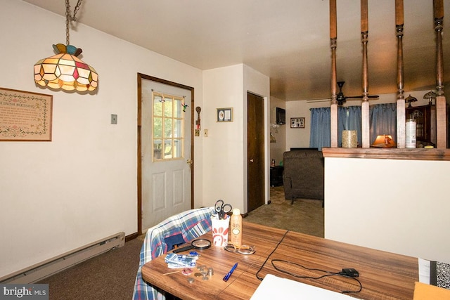 dining area with a baseboard radiator and carpet floors