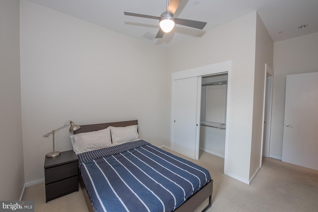 bedroom featuring light carpet, a closet, and ceiling fan