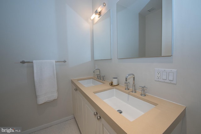 bathroom featuring tile patterned flooring and vanity