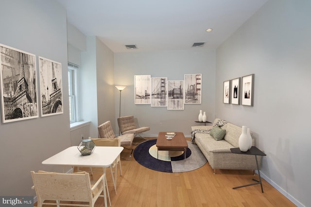 living area with light hardwood / wood-style flooring