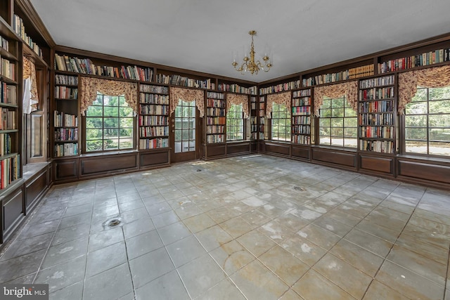 unfurnished sunroom with a notable chandelier