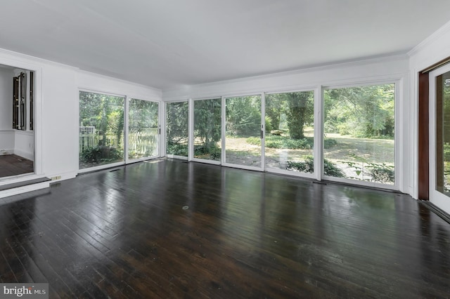 unfurnished sunroom with a wealth of natural light