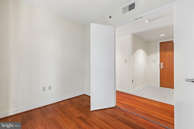 unfurnished room featuring wood-type flooring