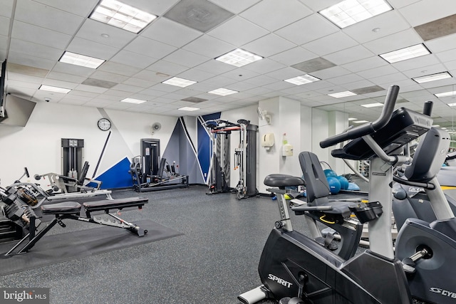 workout area featuring a drop ceiling