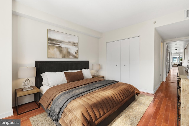 bedroom featuring a closet and wood-type flooring