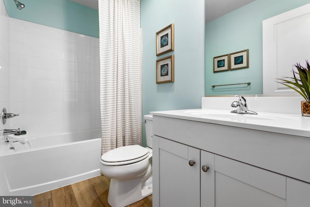 full bathroom with vanity, toilet, wood-type flooring, and shower / tub combo with curtain