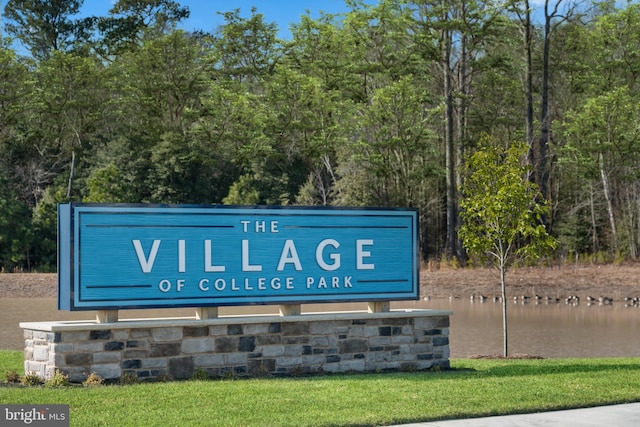 community sign with a water view