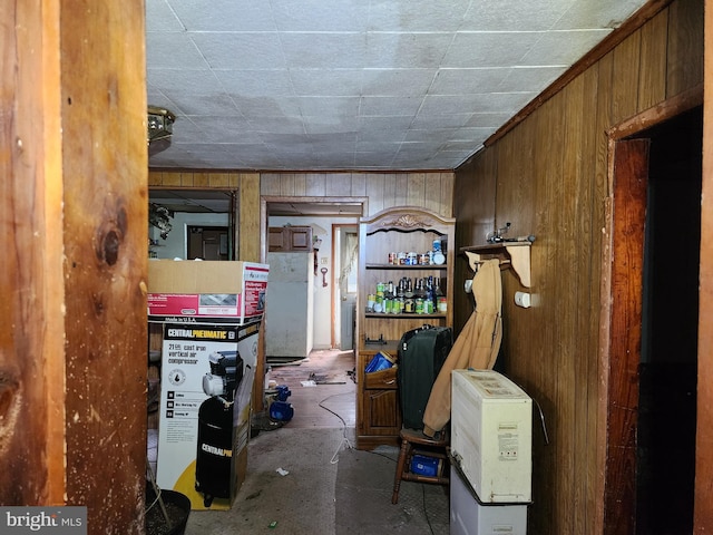 interior space featuring wooden walls