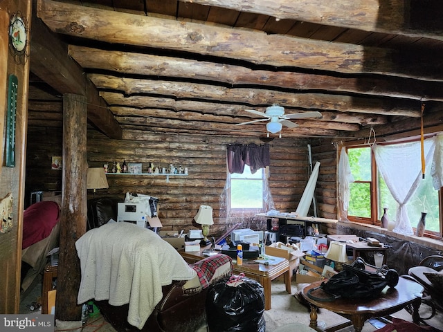 living room featuring beamed ceiling, ceiling fan, wooden ceiling, and rustic walls