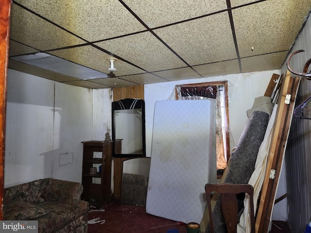 basement featuring a drop ceiling