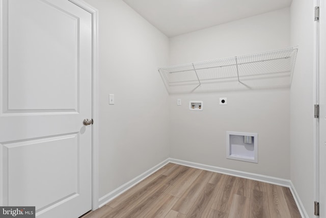 washroom with electric dryer hookup, light wood-type flooring, and washer hookup