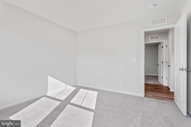 spare room featuring light wood-type flooring