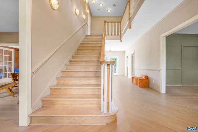 14186 Devils Three Jump Rd, Milford, VA 22514 - stairs with ornamental molding and hardwood / wood-style flooring