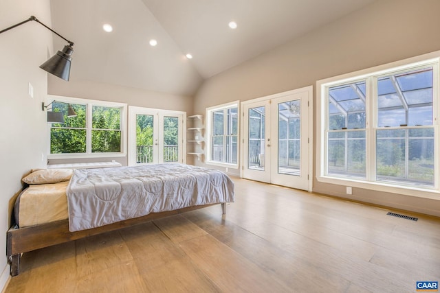 14186 Devils Three Jump Rd, Milford, VA 22514 - bedroom with access to outside, french doors, high vaulted ceiling, and light hardwood / wood-style flooring