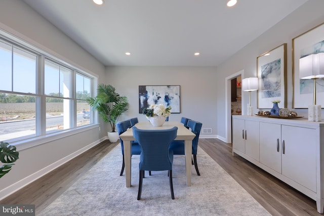 dining area featuring dark wood-type flooring