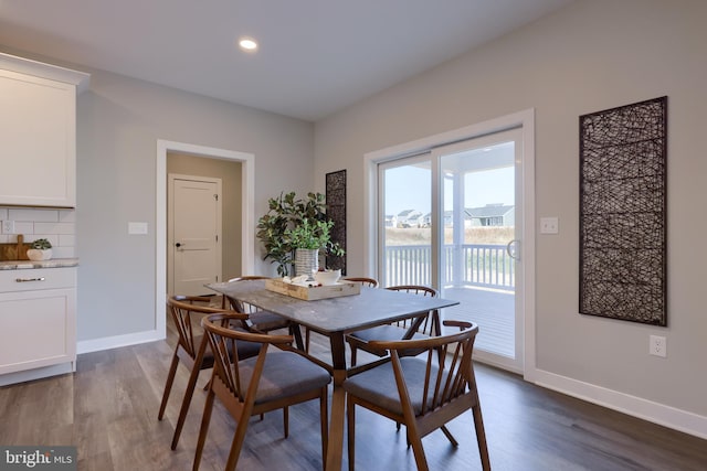 dining space featuring dark hardwood / wood-style floors