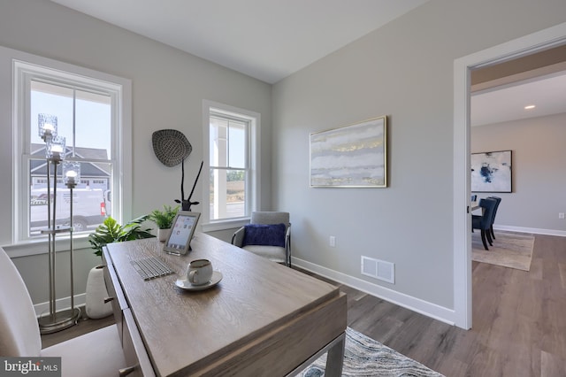 office with dark hardwood / wood-style floors