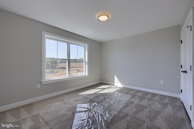 unfurnished room with carpet floors