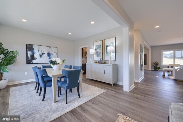 dining area featuring light wood-type flooring