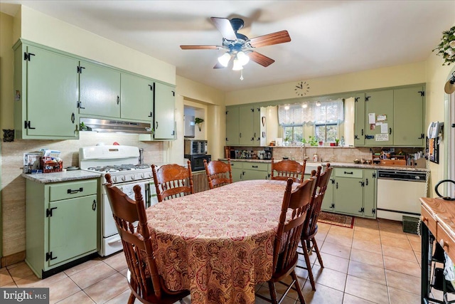 tiled dining room featuring ceiling fan