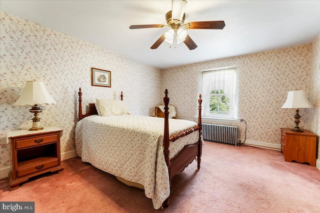 carpeted bedroom featuring ceiling fan and radiator heating unit