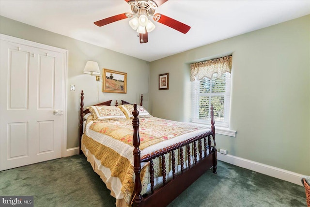 bedroom with dark colored carpet and ceiling fan