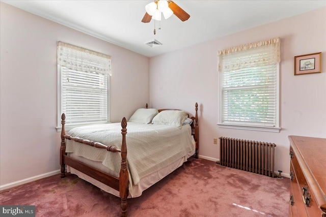 carpeted bedroom featuring radiator heating unit and ceiling fan