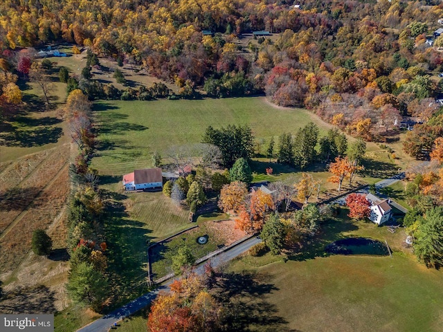 birds eye view of property with a rural view